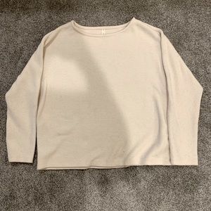 Cream Sweater with a ribbed texture